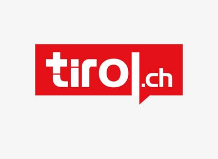Das rote tirol.ch-Logo steht zentriert auf weißem Hintergrund.