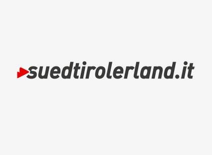 Das Logo von suedtirolerland.it auf weißem Hintergrund.